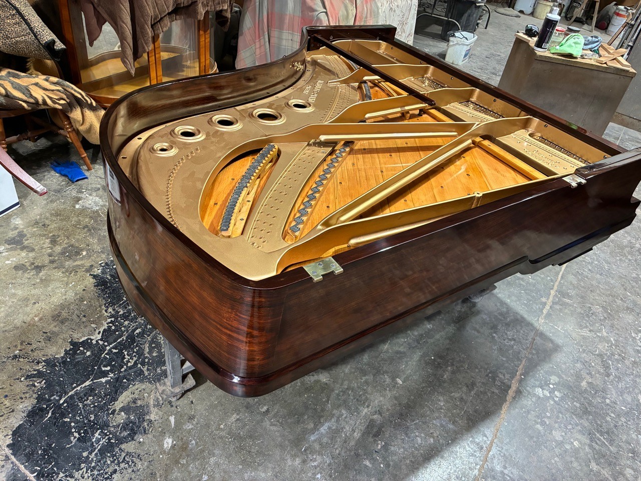 Bluthner grand piano with varnished soundboard and sprayed frame
